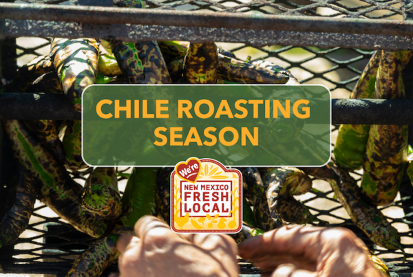 A chile roaster/hopper full of fresh New Mexico green chile peppers