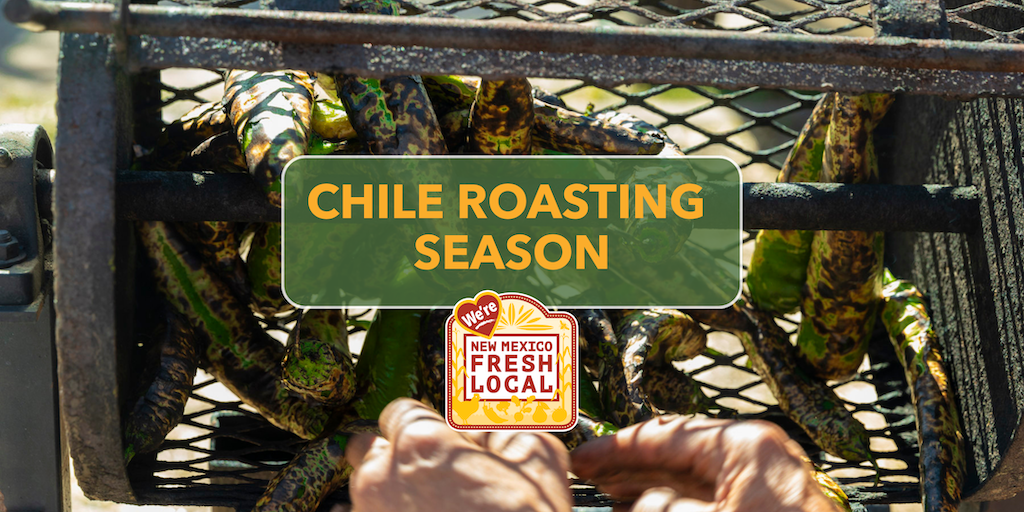 A chile roaster/hopper full of fresh New Mexico green chile peppers