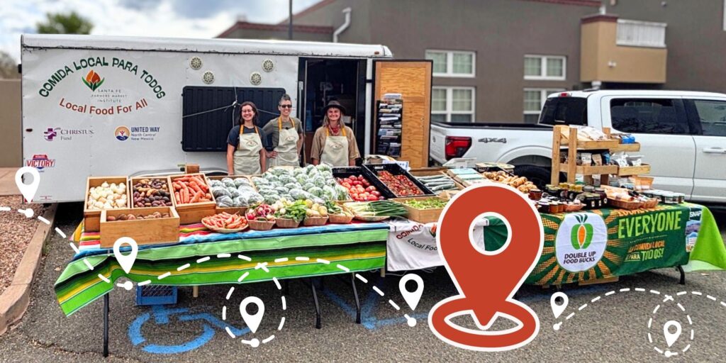 Image: Santa Fe Farmers’ Market Institute staff set up in Santa Fe with the Tianguis Movil/Mobile Market.