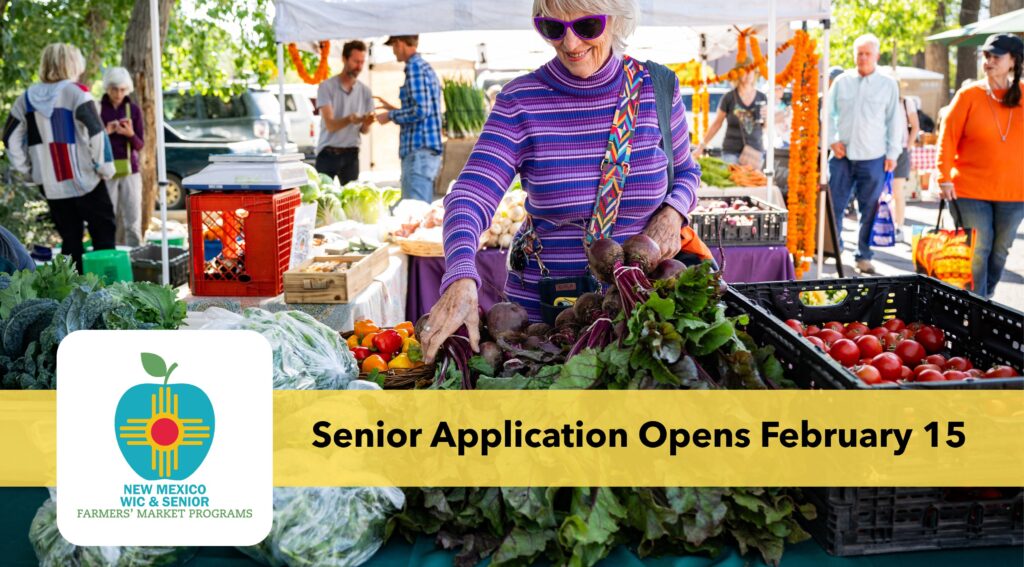 An elderly woman shopping at a farmers' market
